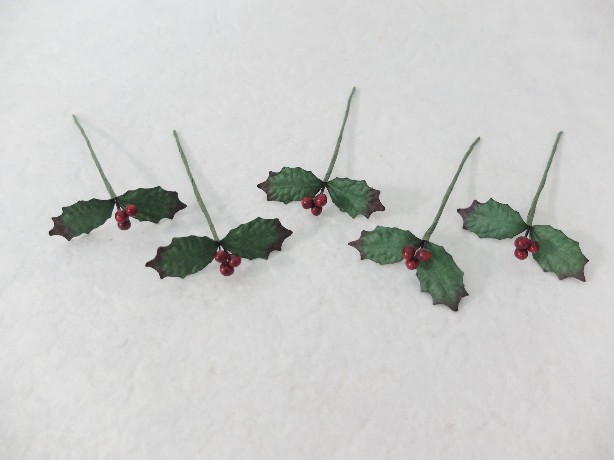 paper holly sprigs with berries