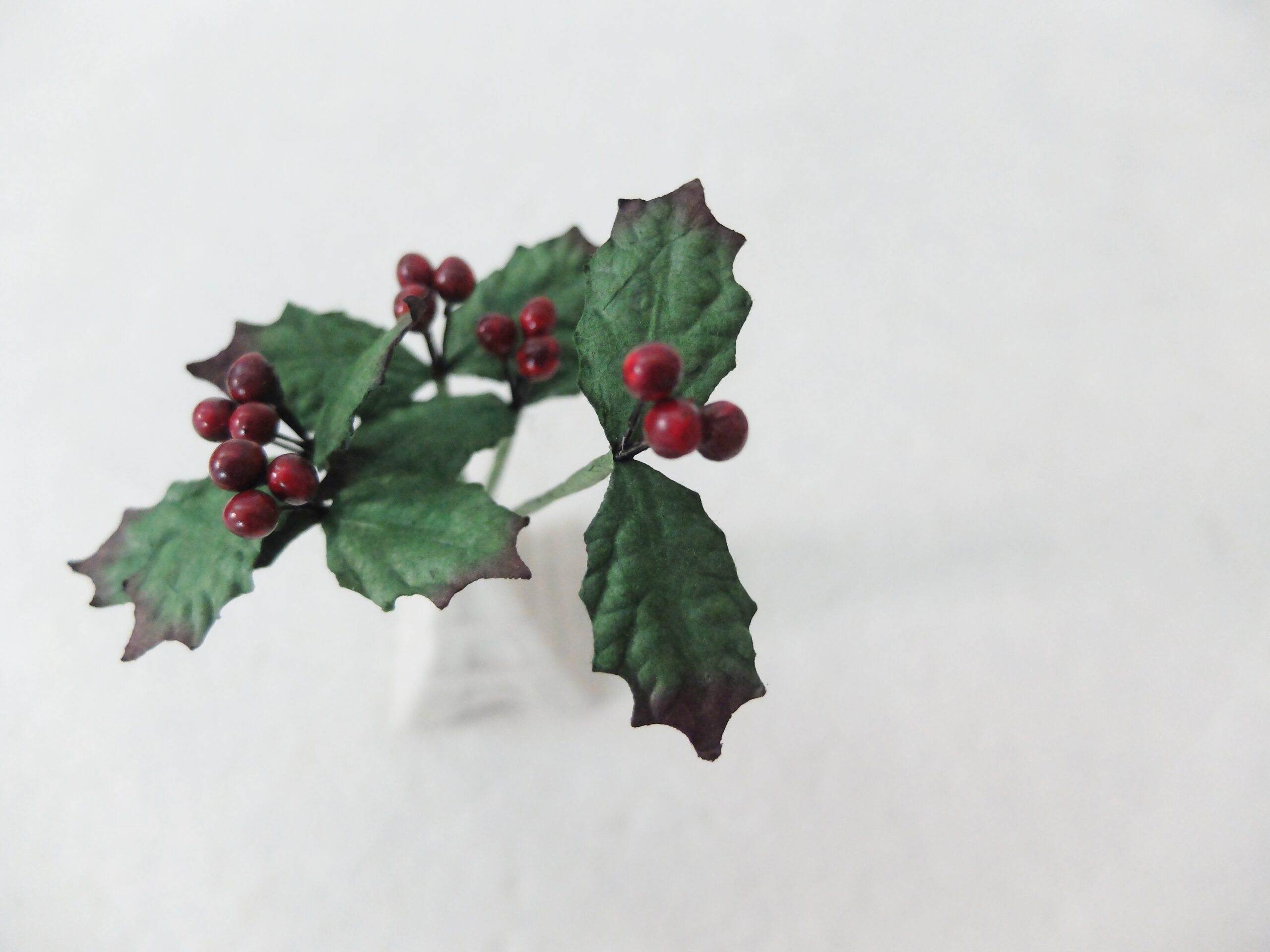 paper holly sprigs with berries